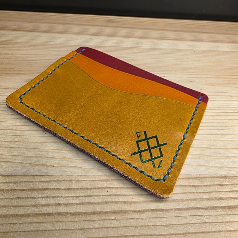 Hand-stitched bifold interior with the Gungnir maker's mark