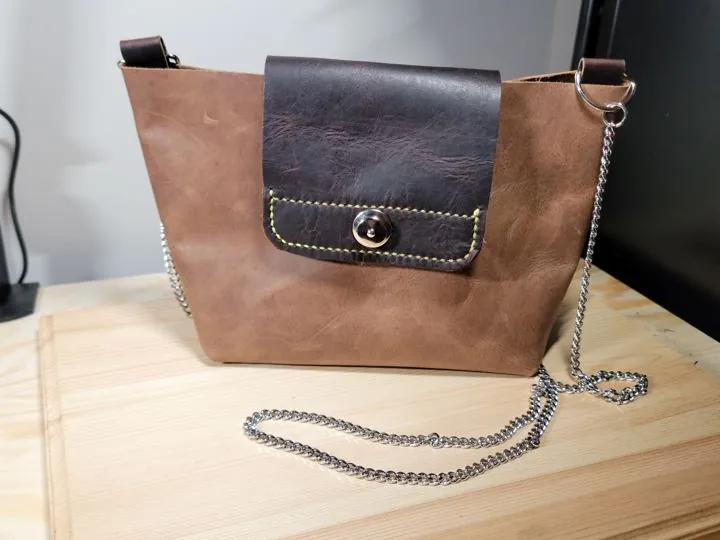 Brown leather crossbody bag with chain strap