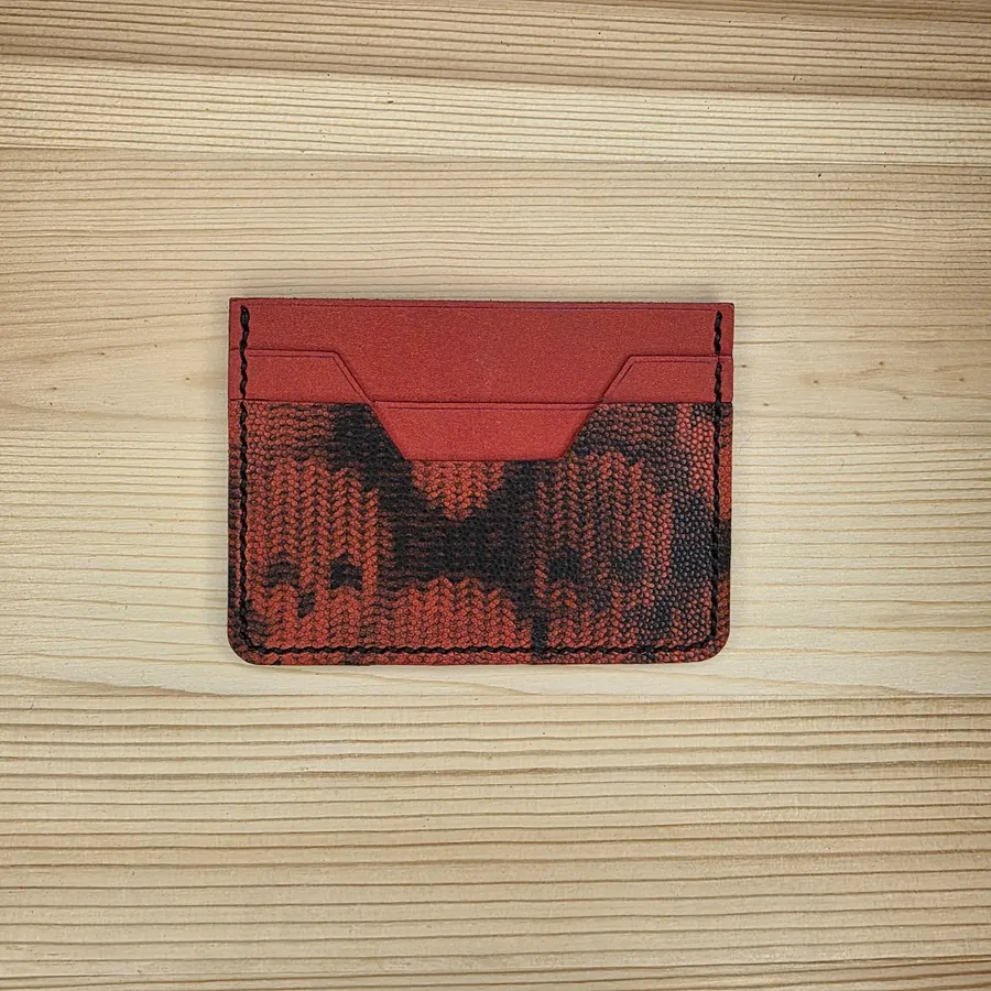 Red cardholder with patterned wave pockets and black saddle stitching